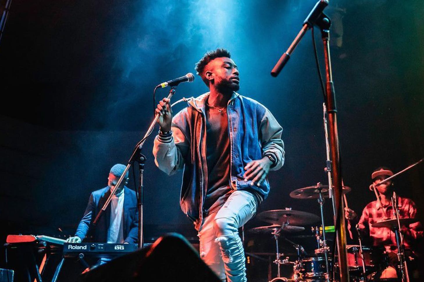 Adrian Dzvuke Preforming On Stage